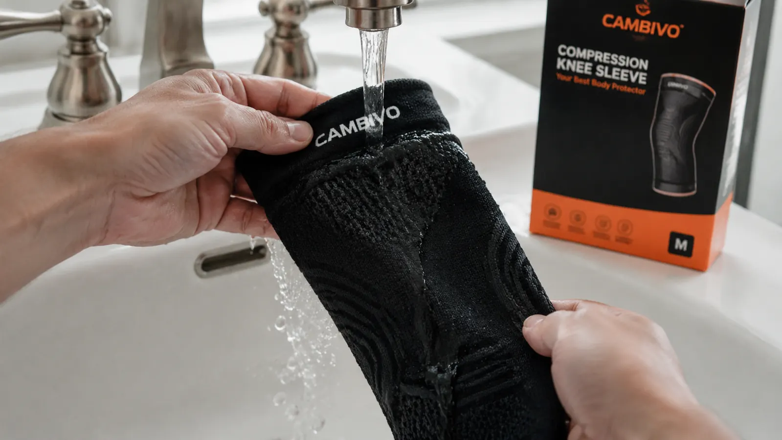 Close-up of a knee sleeve being rinsed under a faucet to show washing care